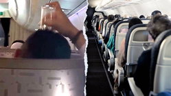 Passenger's bizarre use of drinking glass on flight leaves travelers horrified Melbourne School